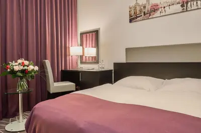 Łóżko lub łóżka w pokoju w obiekcie Sky Business Hotel
