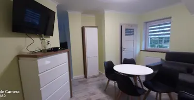 Telewizja i/lub zestaw kina domowego w obiekcie Apartamenty U Iwony Centrum miasta blisko Parku Zdrojowego