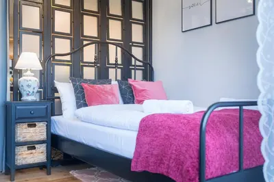 Łóżko lub łóżka w pokoju w obiekcie Apartamenty Słoneczna Polana, MyWeek