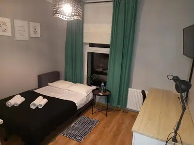 Łóżko lub łóżka w pokoju w obiekcie Przystanek Opole - MIKROAPARTAMENTY