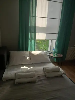 Łóżko lub łóżka w pokoju w obiekcie Przystanek Opole - MIKROAPARTAMENTY