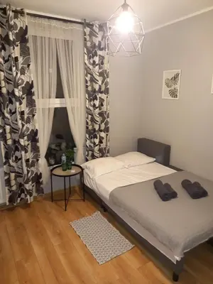 Łóżko lub łóżka w pokoju w obiekcie Przystanek Opole - MIKROAPARTAMENTY