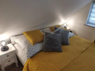 Łóżko lub łóżka w pokoju w obiekcie Apartament ALPa Kudowa Zdrój