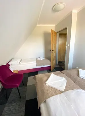 Łóżko lub łóżka w pokoju w obiekcie Ośrodek Szkoleniowo Wypoczynkowy GOPR