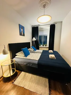 Łóżko lub łóżka w pokoju w obiekcie Apartament Zdrój Lądek