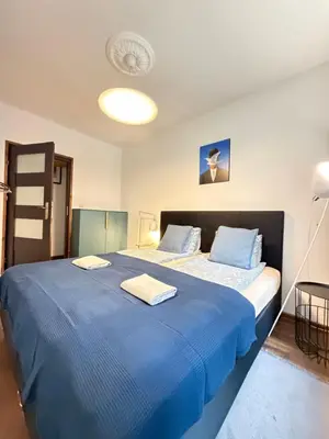 Łóżko lub łóżka w pokoju w obiekcie Apartament Zdrój Lądek