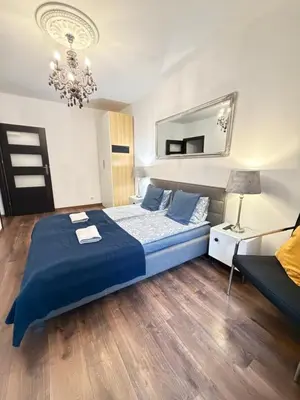 Łóżko lub łóżka w pokoju w obiekcie Apartament Zdrój Lądek