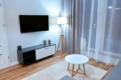 Telewizja i/lub zestaw kina domowego w obiekcie LAGUNA Apartament Polanica Residence 13 z garażem -SPA