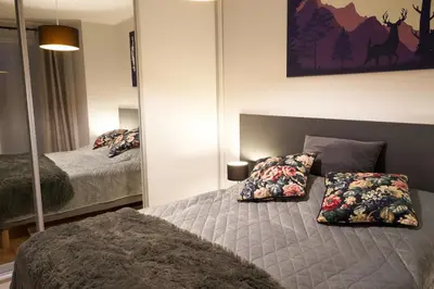 Łóżko lub łóżka w pokoju w obiekcie LAGUNA Apartament Polanica Residence 13 z garażem -SPA