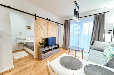 Łóżko lub łóżka w pokoju w obiekcie LAGUNA Apartament Polanica Residence 32