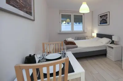 Łóżko lub łóżka w pokoju w obiekcie KDRO Apartment Szewska Rynek