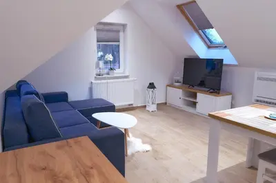 Telewizja i/lub zestaw kina domowego w obiekcie LAGUNA Apartament 