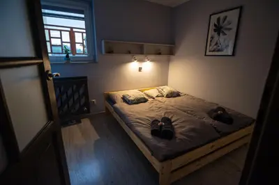 Łóżko lub łóżka w pokoju w obiekcie Apartament Tuzanocuj