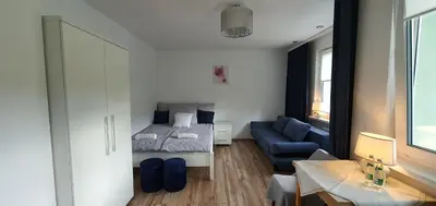 Łóżko lub łóżka w pokoju w obiekcie Apartament Altheide