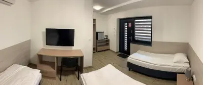Łóżko lub łóżka w pokoju w obiekcie Ludowa Restauracja & Noclegi