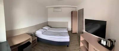 Łóżko lub łóżka w pokoju w obiekcie Ludowa Restauracja & Noclegi