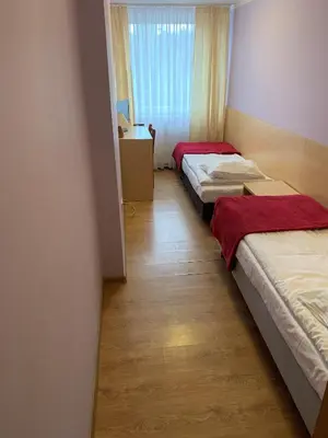 Łóżko lub łóżka w pokoju w obiekcie Ludowa Restauracja & Noclegi