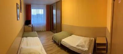 Łóżko lub łóżka w pokoju w obiekcie Ludowa Restauracja & Noclegi