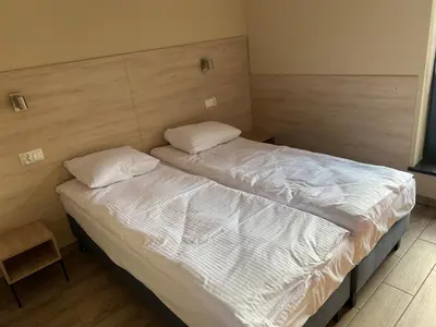 Łóżko lub łóżka w pokoju w obiekcie Ludowa Restauracja & Noclegi