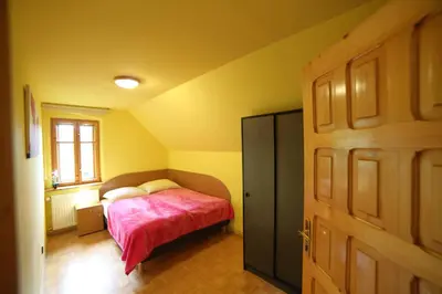 Łóżko lub łóżka w pokoju w obiekcie Leśny Dwór