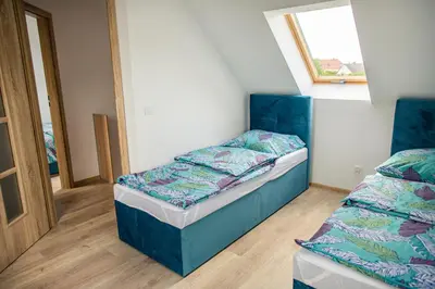 Łóżko lub łóżka w pokoju w obiekcie Domki całoroczne Jesionowscy - sauna
