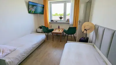 Łóżko lub łóżka w pokoju w obiekcie Dom nad Jeziorem