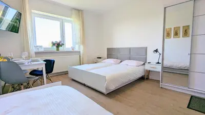 Łóżko lub łóżka w pokoju w obiekcie Dom nad Jeziorem