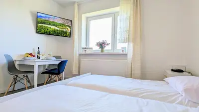 Łóżko lub łóżka w pokoju w obiekcie Dom nad Jeziorem