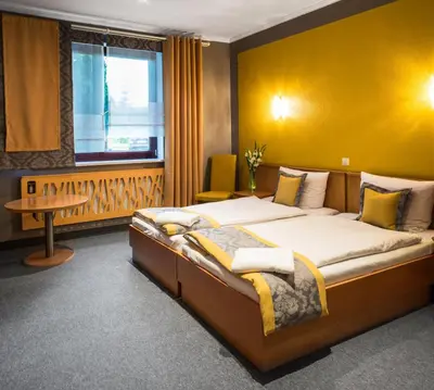 Łóżko lub łóżka w pokoju w obiekcie Hotel Restauracja Tawerna Gliwice - duży parking gratis