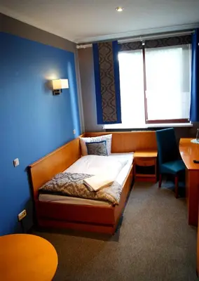 Łóżko lub łóżka w pokoju w obiekcie Hotel Restauracja Tawerna Gliwice - duży parking gratis