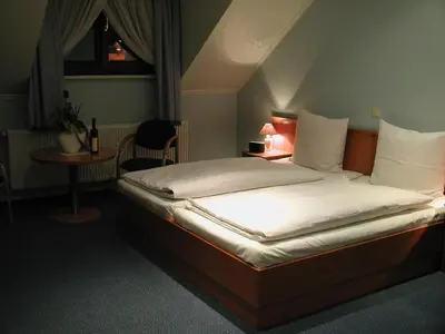 Łóżko lub łóżka w pokoju w obiekcie Hotel Restauracja Tawerna Gliwice - duży parking gratis