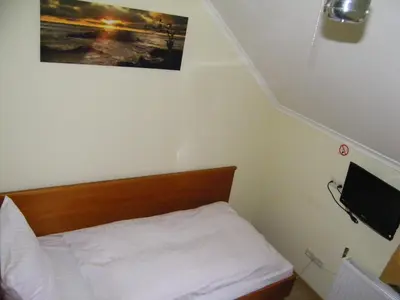 Łóżko lub łóżka w pokoju w obiekcie Hotel Restauracja Tawerna Gliwice - duży parking gratis