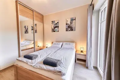 Łóżko lub łóżka w pokoju w obiekcie LAGUNA Apartament Podróżnika 22 Wille Parkowe