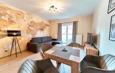 Telewizja i/lub zestaw kina domowego w obiekcie LAGUNA Apartament Podróżnika 22 Wille Parkowe