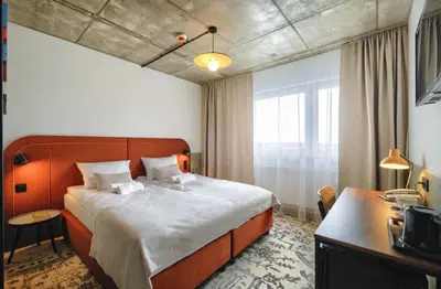 Łóżko lub łóżka w pokoju w obiekcie Arche Hotel Wrocław Airport