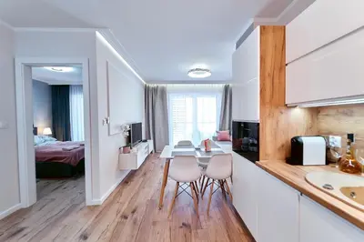 Łóżko lub łóżka w pokoju w obiekcie LAGUNA Apartament Polanica Residence 28-SPA