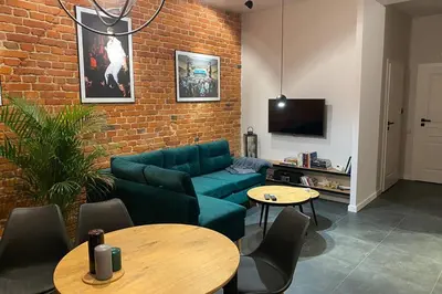 Telewizja i/lub zestaw kina domowego w obiekcie Stylowy apartament tuż przy Rynku