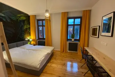 Łóżko lub łóżka w pokoju w obiekcie Stylowy apartament tuż przy Rynku