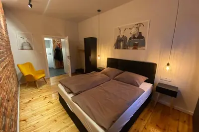 Łóżko lub łóżka w pokoju w obiekcie Stylowy apartament tuż przy Rynku