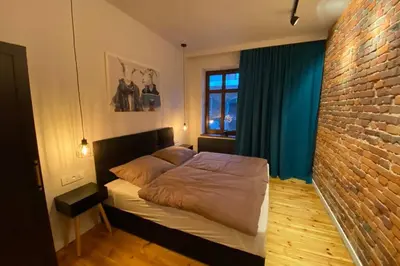 Łóżko lub łóżka w pokoju w obiekcie Stylowy apartament tuż przy Rynku