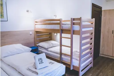Łóżko lub łóżka w pokoju w obiekcie Owca z widokiem
