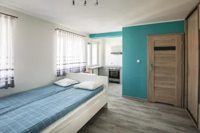 Łóżko lub łóżka w pokoju w obiekcie High Floor Vision Apartment