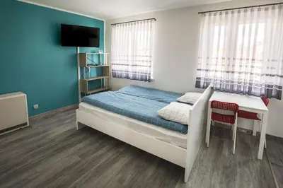 Łóżko lub łóżka w pokoju w obiekcie High Floor Vision Apartment