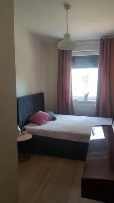 Łóżko lub łóżka w pokoju w obiekcie Przytulne mieszkanie w cichej okolicy