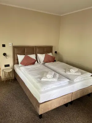 Łóżko lub łóżka w pokoju w obiekcie Villa Marta
