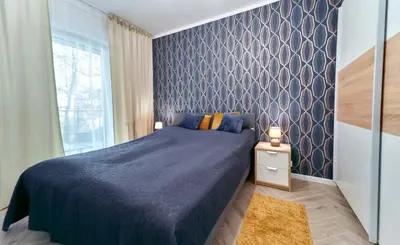 Łóżko lub łóżka w pokoju w obiekcie LAGUNA Apartament Polanica Residence 10 - Mini SPA