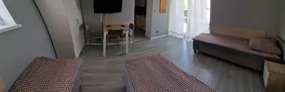 Łóżko lub łóżka w pokoju w obiekcie NOCLEGI u ALI