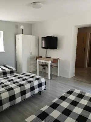 Łóżko lub łóżka w pokoju w obiekcie NOCLEGI u ALI