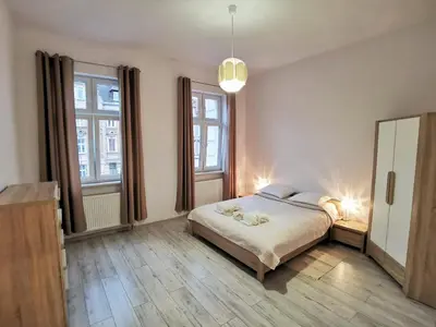 Łóżko lub łóżka w pokoju w obiekcie Apartament Seven