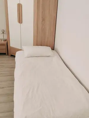 Łóżko lub łóżka w pokoju w obiekcie Apartament Seven